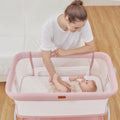 Baby Bassinet Bedside Crib with Mattress & Sheet, 4-Sided Mesh, Pink Q70977